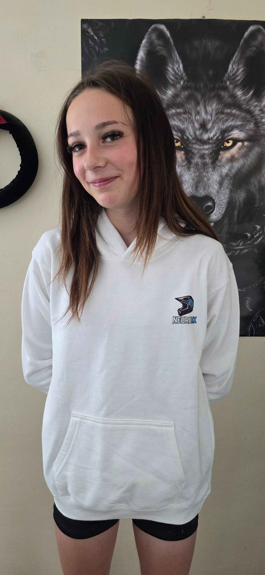 Smiling woman wearing a white motocross hoodie with NeuroMX logo, wolf poster behind her.
