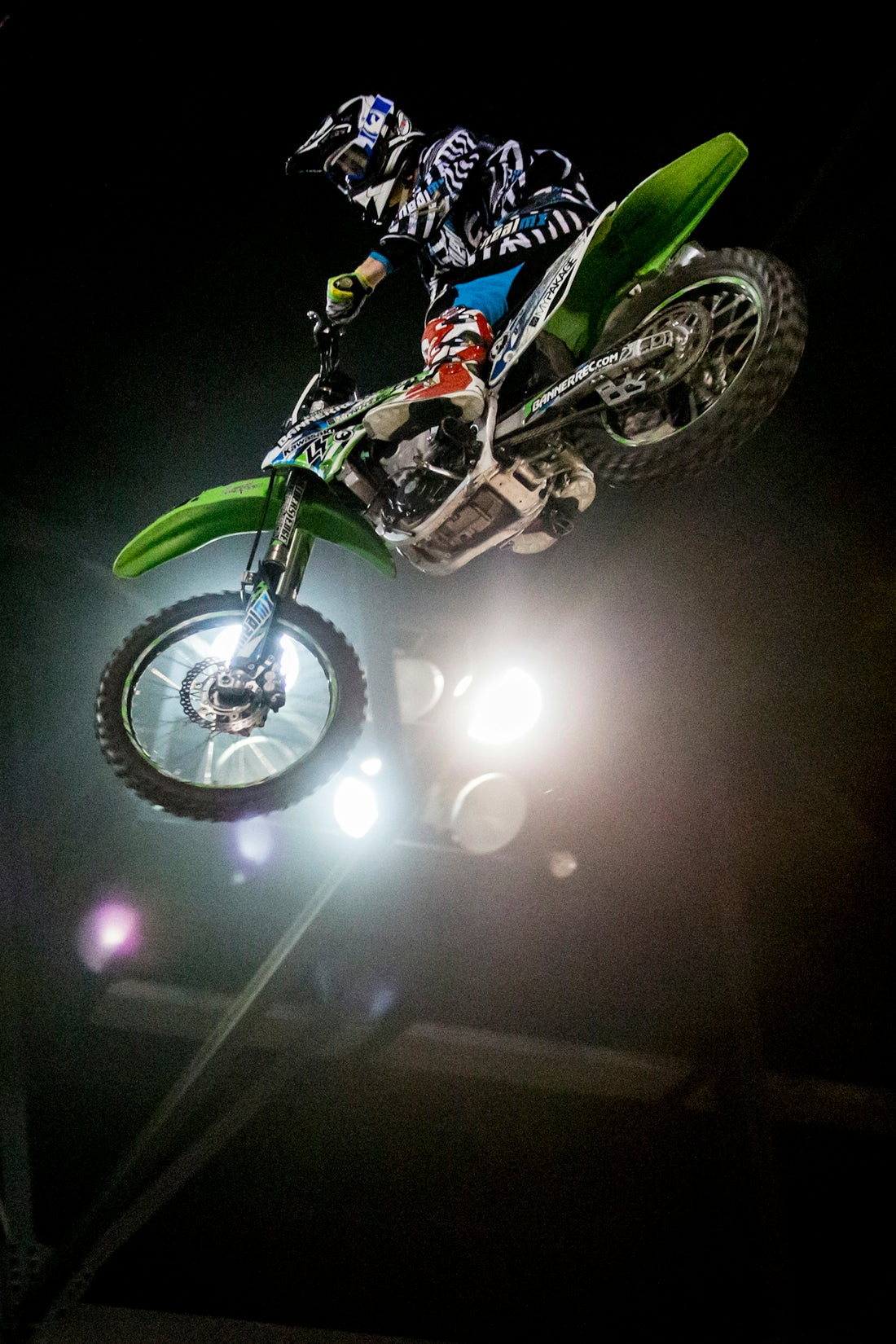 green and black motocross dirt bike